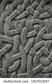 Abstract Background Detail Of A Celtic Knot Pattern In Stone