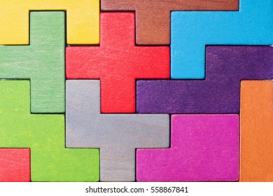 Abstract Background. Background with different colorful shapes wooden blocks . Geometric shapes in different colors. Concept of creative, logical thinking or problem solving. 