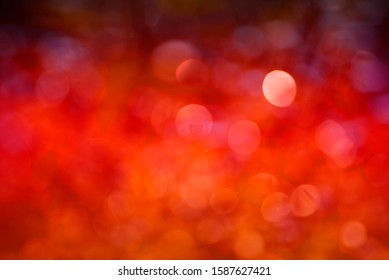 Abstract background The distribution of white bokeh on a reddish orange background. Trend color 2020 - Powered by Shutterstock