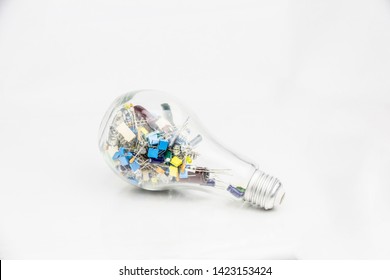 Abstract Background Of Electronic Technology With An New Inovation Idea, Electronics Component Put In The Bulb.