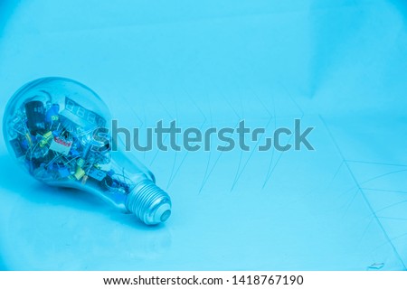 Abstract Background of electronic technology with an new inovation idea, electronics component put in the bulb.