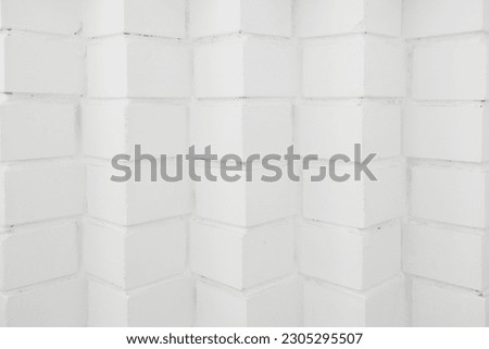 Abstract background. Empty white brick surface. Original brick laying at angle forward. Back for design