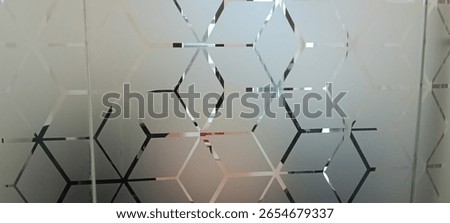 Abstract background of etched glass with hexagonal shapes. Architectural decor.