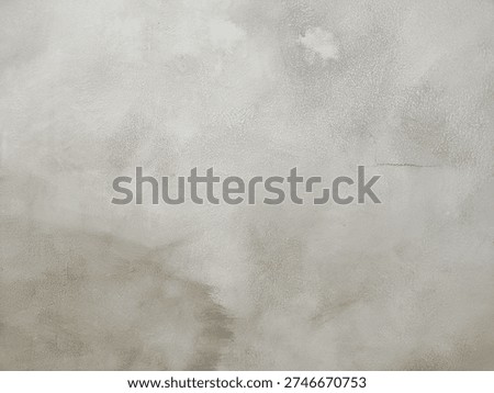 Abstract background featuring a rough, weathered gray surface with a textured finish. Ideal for design projects requiring an industrial, vintage, or minimalist aesthetic.