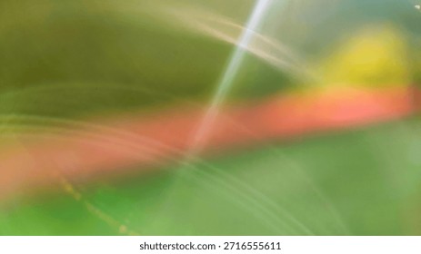 Abstract background featuring soft diagonal stripes in pink, lime green, and yellow, creating a vibrant blurred texture ideal for creative overlays, banners, and modern designs.