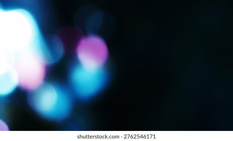 Abstract background featuring soft, out-of-focus bokeh lights in vibrant blue and pink tones against a dark backdrop.