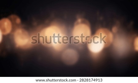 Abstract background featuring soft, out-of-focus golden bokeh lights creating a warm and inviting atmosphere with a dark, textured backdrop.