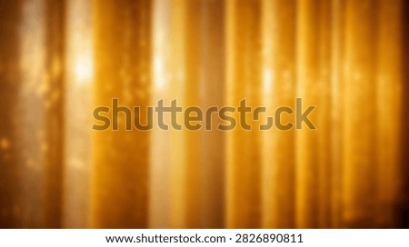 Abstract background featuring vertical golden light streaks and soft bokeh highlights, creating a warm and luminous effect.