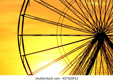 Abstract Background, ferris metal-wheel against sky with sunset. - Powered by Shutterstock