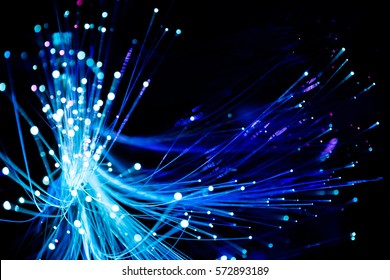 Abstract background  fiber optics close up, computer communication technology. Optical lighting. - Shutterstock ID 572893189