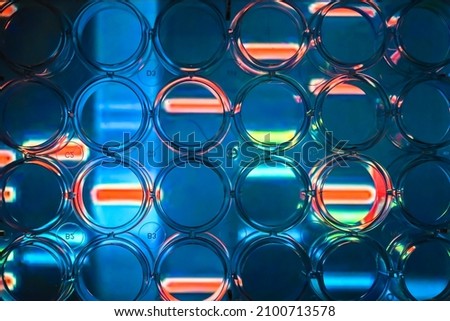 Abstract background - genome research. A look through a 24-well plate.