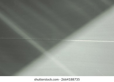 Abstract background of geometric lines and soft shadows on a tiled surface. Minimalist composition