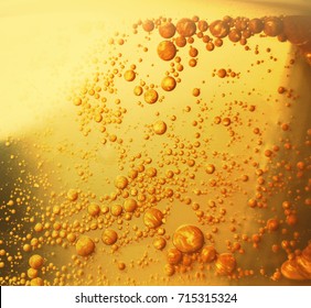 Abstract background with golden oil in water. 