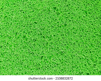 Abstract Background Of Green Curly Rubber Door Mat