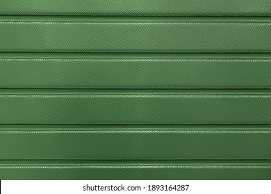 Abstract Background Of Green Embossed Plastic Surface Close Up