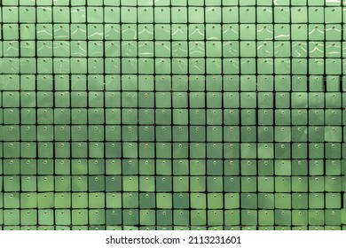 Abstract Background Of Green Shiny Plastic Tiled Surface Close Up