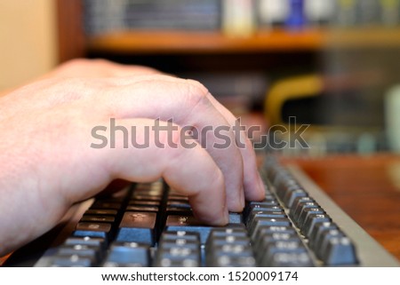 Abstract background with hands on the keyboar.