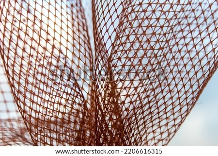 Abstract background image and texture made with plastic or mesh fabric. Close-up