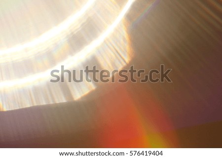 Abstract background - light color flashes and rays on black. Lens flare. For use as texture layer in your project. Add as 