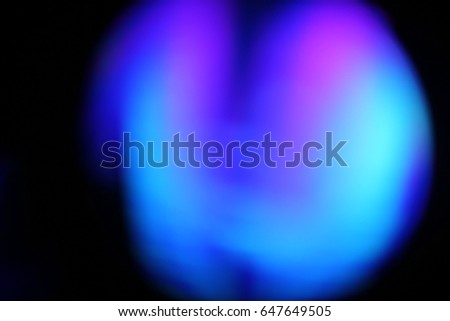 Abstract background - light color flashes and rays on black. Lens flare. For use as texture layer in your project. Add as 
