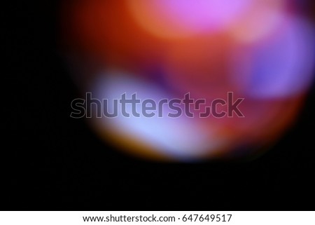 Abstract background - light color flashes and rays on black. Lens flare. For use as texture layer in your project. Add as 