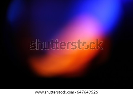 Abstract background - light color flashes and rays on black. Lens flare. For use as texture layer in your project. Add as 