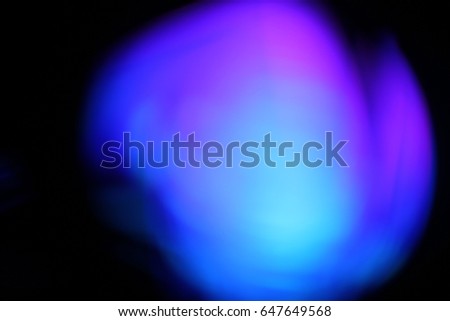 Abstract background - light color flashes and rays on black. Lens flare. For use as texture layer in your project. Add as 