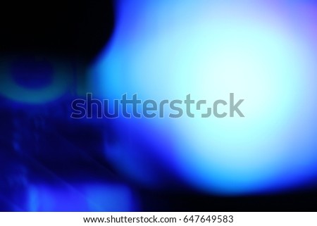 Abstract background - light color flashes and rays on black. Lens flare. For use as texture layer in your project. Add as 