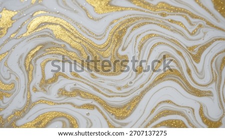 An abstract background with a liquid marble effect. Swirling patterns of white and gold create a luxurious and elegant texture, perfect for sophisticated design projects and wallpapers.
