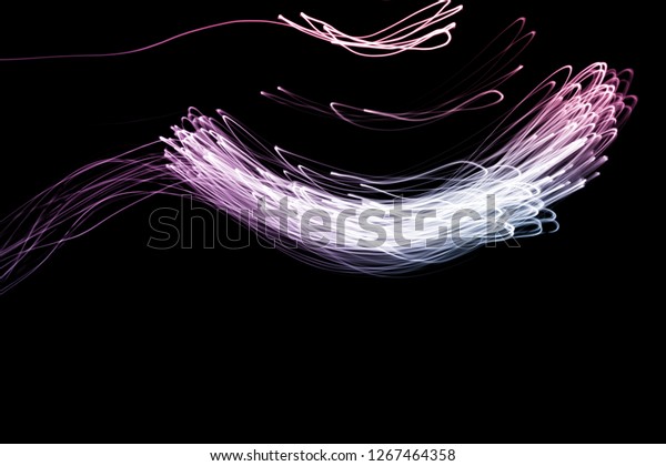 Abstract background of long explosure tale purple
and blue light