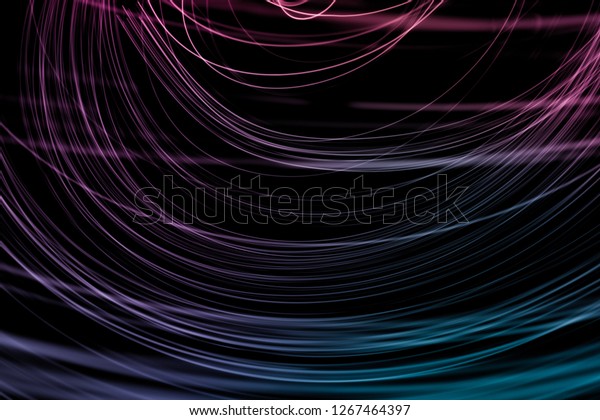 Abstract background of long explosure tale purple\
and blue light