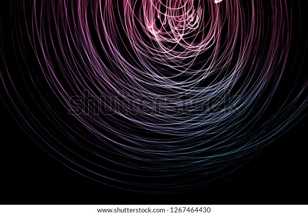 Abstract background of long explosure tale purple\
and blue light