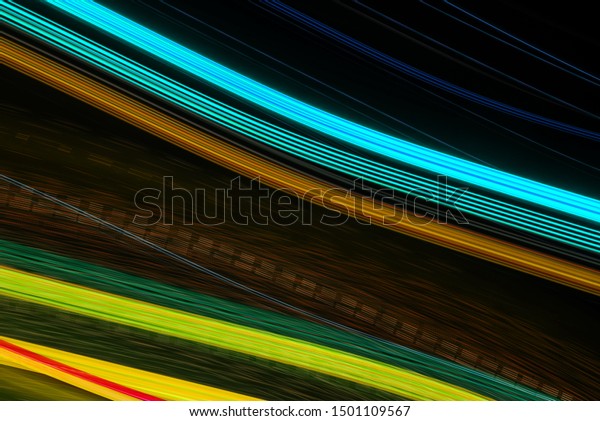 Abstract background of long explosure tale light on
black .