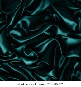 Abstract Background Luxury Cloth Or Liquid Wave Or Wavy Folds Of Grunge Teal Silk Texture Satin Velvet Material Or Luxurious