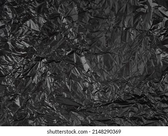 Abstract Background Made Of Black Shiny Plastic.