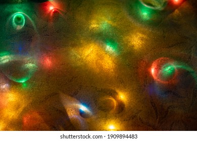 Abstract Background Made From Christmas Lights And Opaque Paper Sheet.