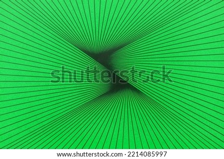Abstract background made in the form of converging lines on a green surface.