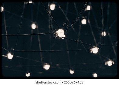 abstract background is a metal structure made of thin rods with light bulbs in a geometric sequence. strange art objects for home and office. High quality photo - Powered by Shutterstock