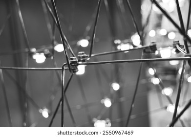 abstract background is a metal structure made of thin rods with light bulbs in a geometric sequence. strange art objects for home and office. High quality photo - Powered by Shutterstock