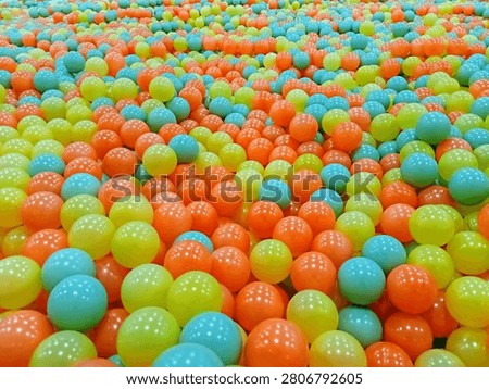 Abstract Background of Multicolored Plastic Balls for Kids Entertainment