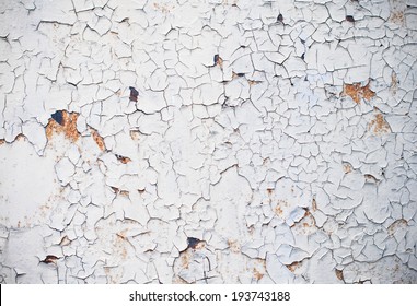 Abstract background, old cracked plaster wall, brown texture, paint stains and cracks.