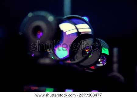 abstract background with optical lenses of different diopters refracting different colors like bokeh. optical instrument gadget theme or just a beautiful techno background with lenses. 