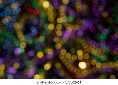Abstract background of out of focus Mardi Gras Beads
