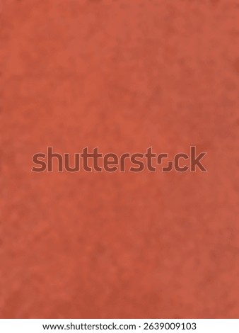 The abstract background is out of focus. Texture of a salmon or orange furry surface, suitable for flooring or background.