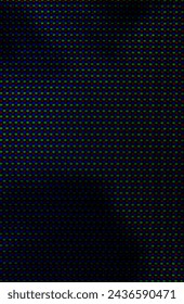 abstract background pattern of colored blurry dots on a dark background close up