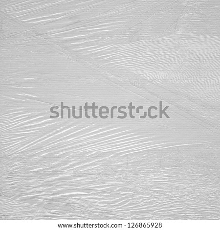 Abstract background from plastic packaging film in the sunshine