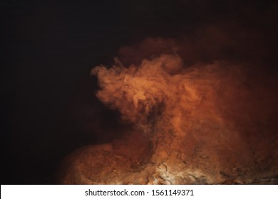 Abstract background, red, orange and brown nebula color, creative liquid texture, dark and light, red river water and dust floating in water, photography - Shutterstock ID 1561149371