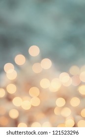 Abstract background of retro tinted holiday lights with copy space.