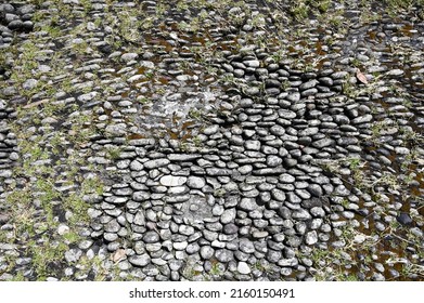 Abstract background with round pebble stones. Vacation holiday recreation on the beach. - Shutterstock ID 2160150491