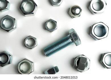 abstract background of a scattering of bolts and nuts - Shutterstock ID 2048011013